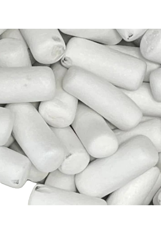 Close-up of white cylindrical chewing gum pieces.