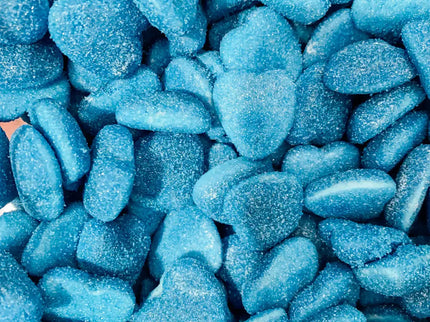 Close-up of blue gummy candies coated in sugar.