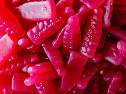 Bright red gummy candy shaped like lips with white teeth details.