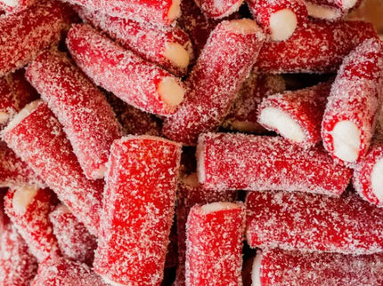 Close-up of red and white gummy candy sticks coated in sugar.