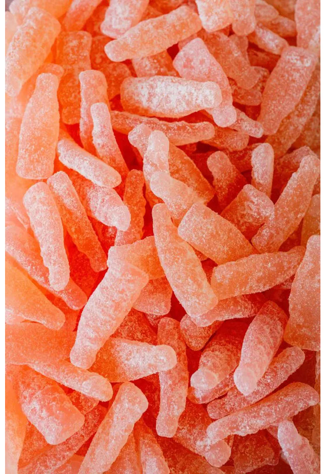 Close-up of orange crystalline candy pieces.