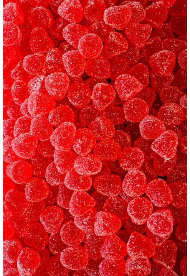 Close-up of red gummy candies covered in sugar crystals.