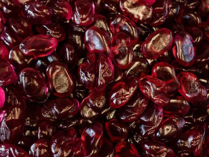 Close-up of shiny, dark red kidney beans packed tightly together.