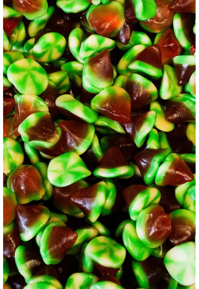 Close-up of green and brown gummy candies.