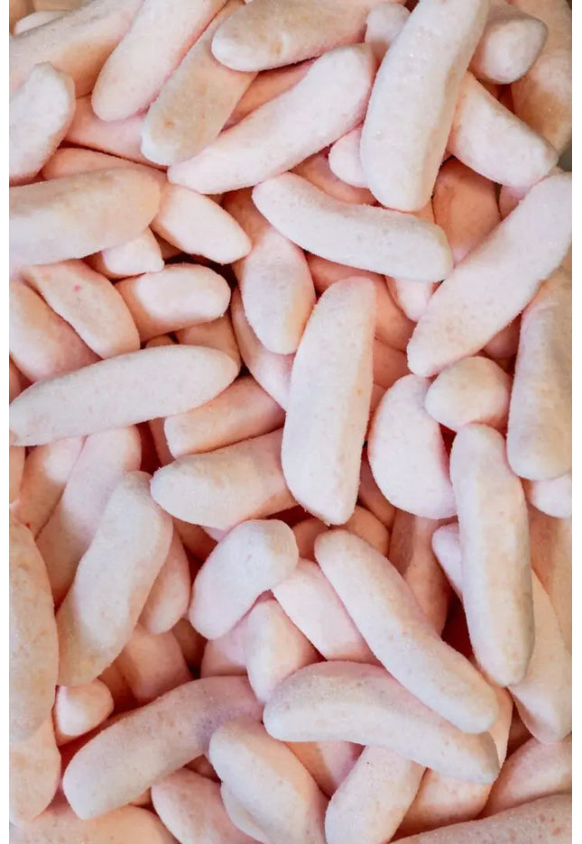 Close-up of pink foam packing peanuts for cushioning.