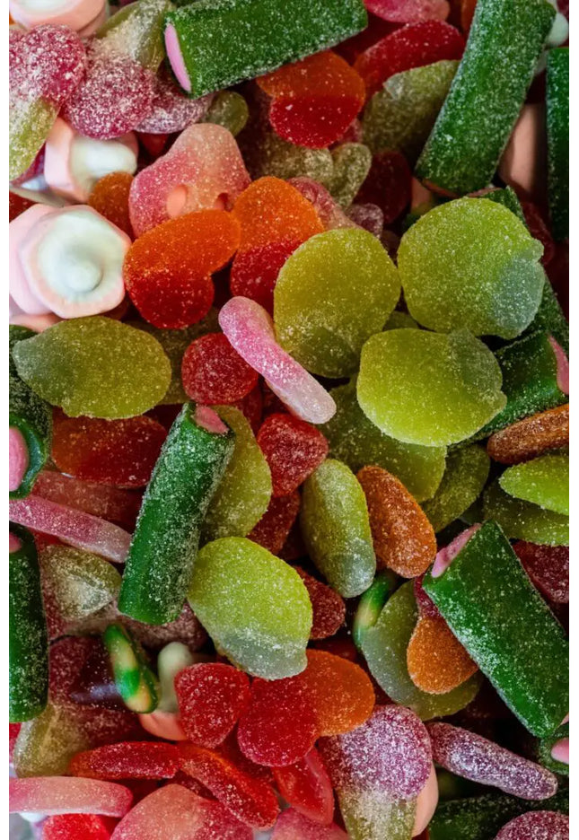 Close-up of assorted colorful gummy candies coated in sugar.