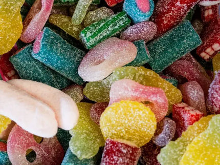 Colorful assorted gummy candies in various shapes and flavors.