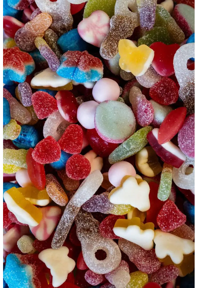 Colorful mixed gummy candies in various shapes and flavors.