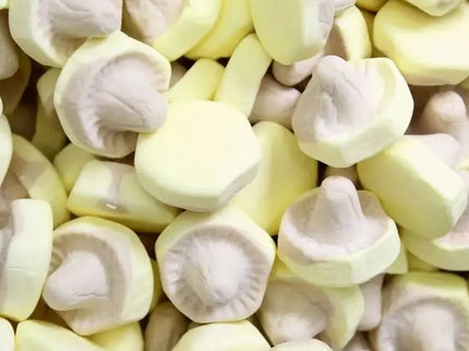 Close-up of yellow and white mushroom-shaped candy pieces.