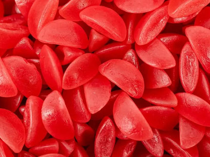 Close-up of red gummy candies shaped like lips.