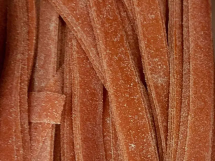 Red gummy candy strips with sugar coating.