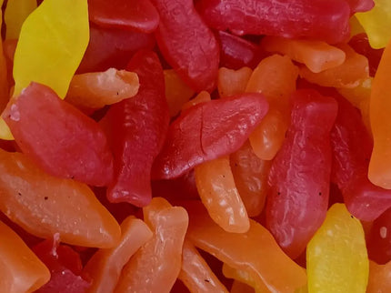Colorful gummy candies in fish shapes.