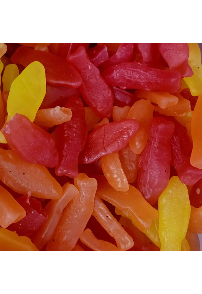 Colorful gummy candies in fish shapes.