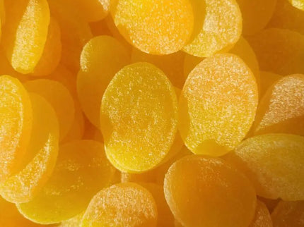 Bright yellow sugar-coated candy slices.