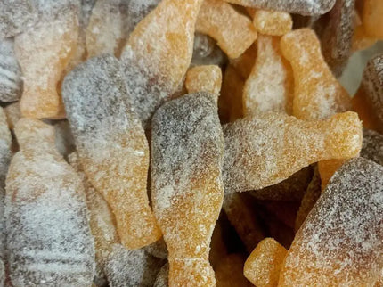 Cola bottle-shaped gummy candies with sugar.