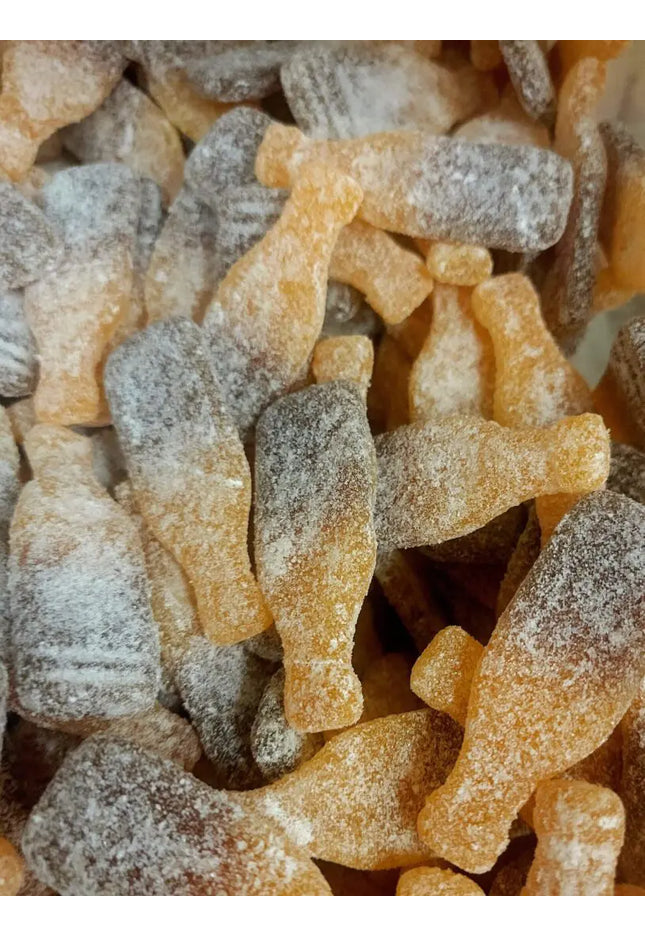 Cola bottle-shaped gummy candies with sugar.