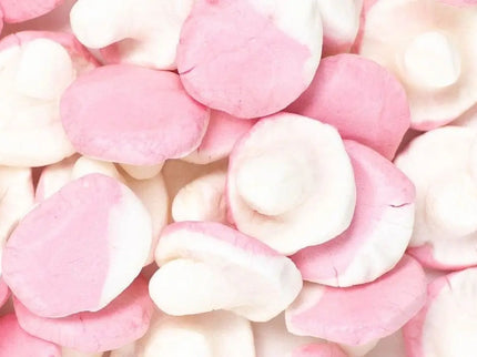 Close-up of pink and white gummy candies resembling mushrooms.
