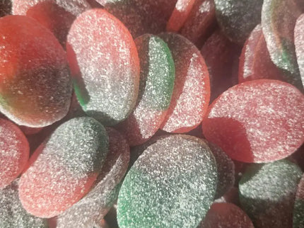 Red and green sugar-coated gummy candies.