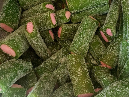 Green and pink sugar-coated candy pieces.