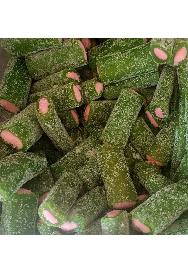 Green and pink sugar-coated candy pieces.