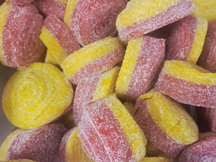Colorful sugar-coated candy spirals close-up.